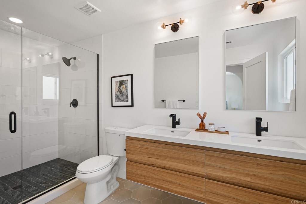 6125 Laport Street La Mesa, CA 91942 - Photo 26 of 32 a bathroom with a sink a toilet and shower