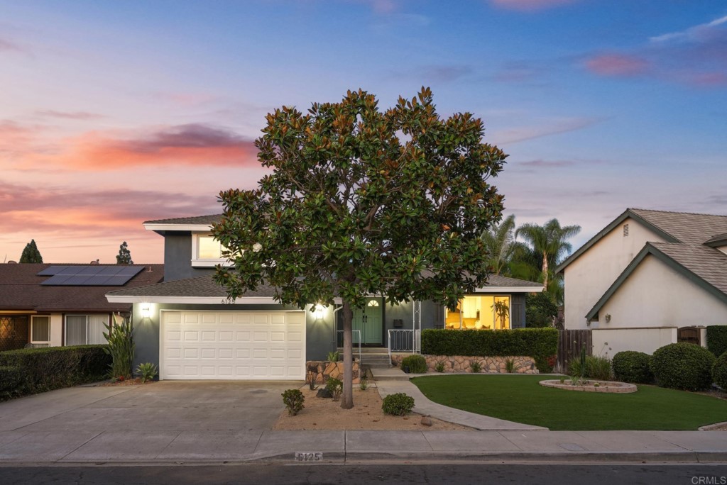 6125 Laport Street La Mesa, CA 91942 - Photo 6 of 32 a front view of a house with a garden