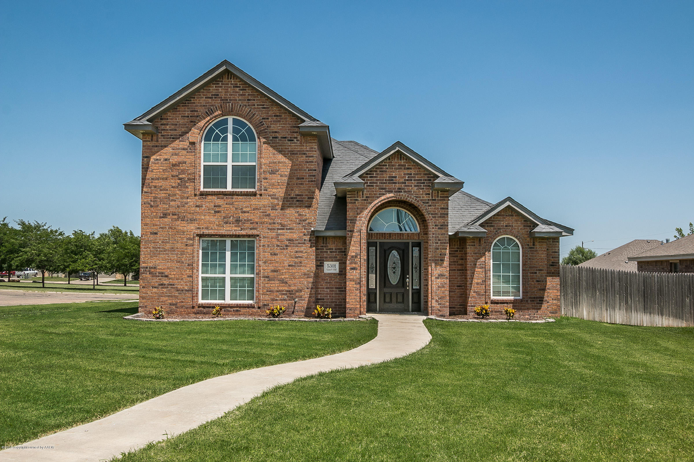 5301 Pleasant Court Amarillo, TX 79110 - Photo 1 of 28 a front view of a house with a yard