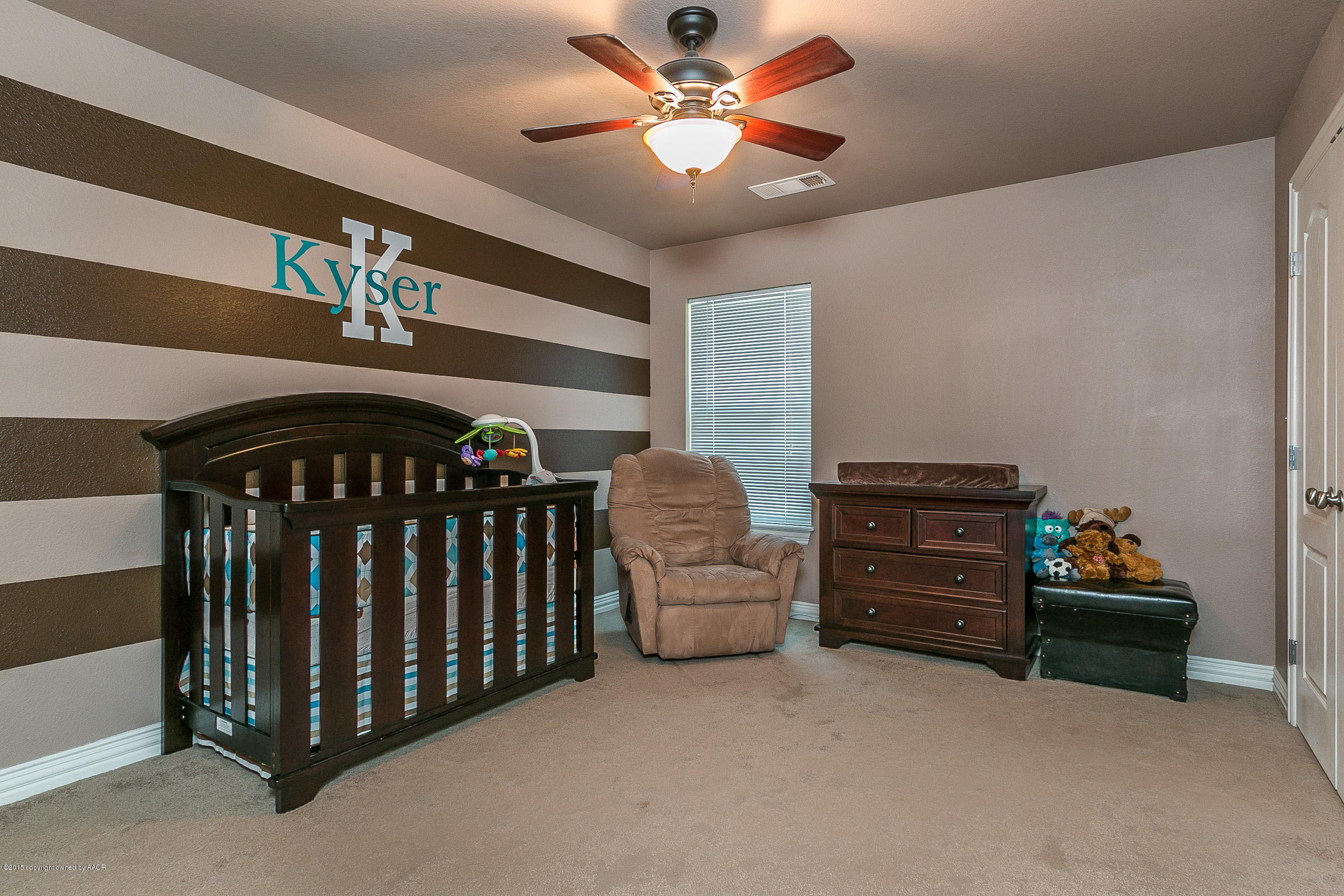 5301 Pleasant Court Amarillo, TX 79110 - Photo 18 of 28 a bedroom with furniture and a chandelier