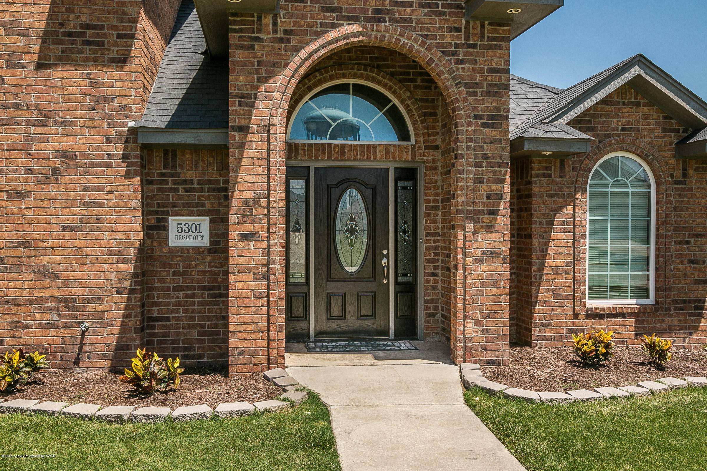 5301 Pleasant Court Amarillo, TX 79110 - Photo 2 of 28 a front view of a house with garden