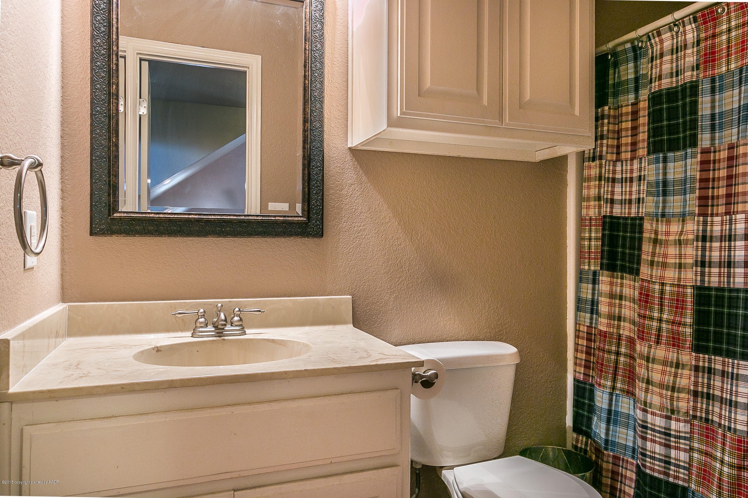 5301 Pleasant Court Amarillo, TX 79110 - Photo 21 of 28 a bathroom with a sink and a toilet