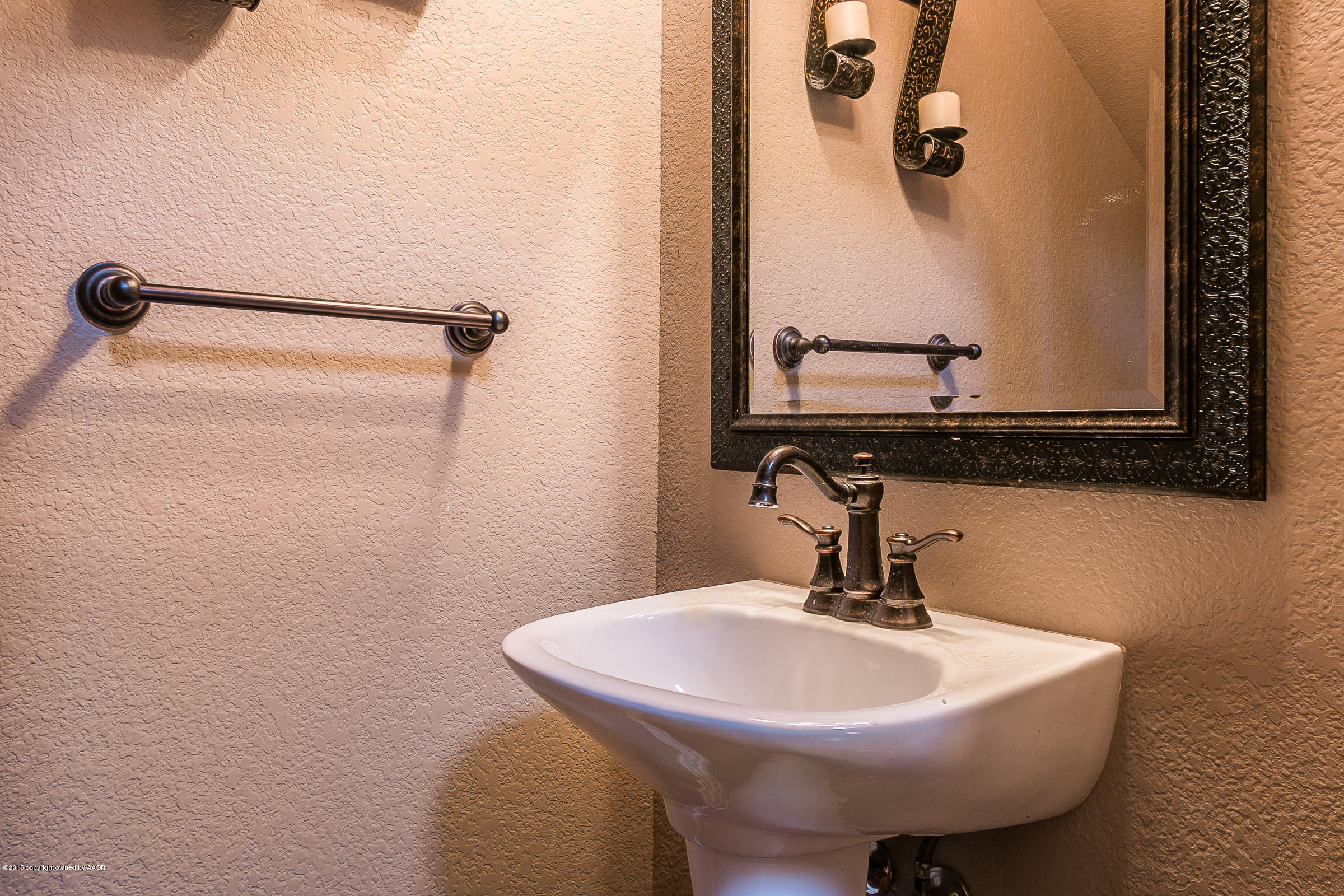 5301 Pleasant Court Amarillo, TX 79110 - Photo 23 of 28 a bathroom with a sink and mirror