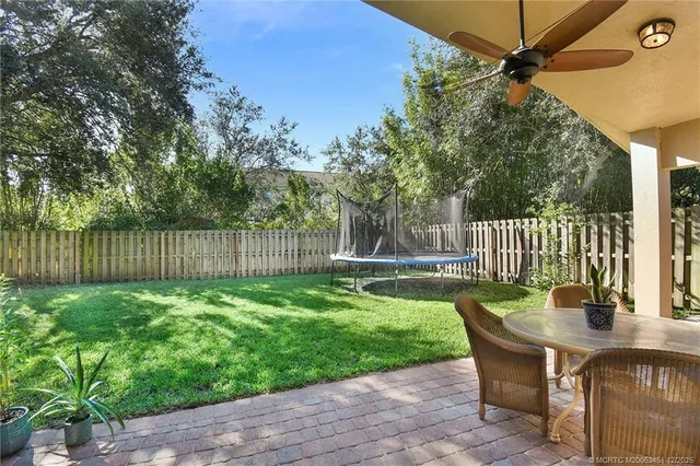 a view of a chair and table in the garden