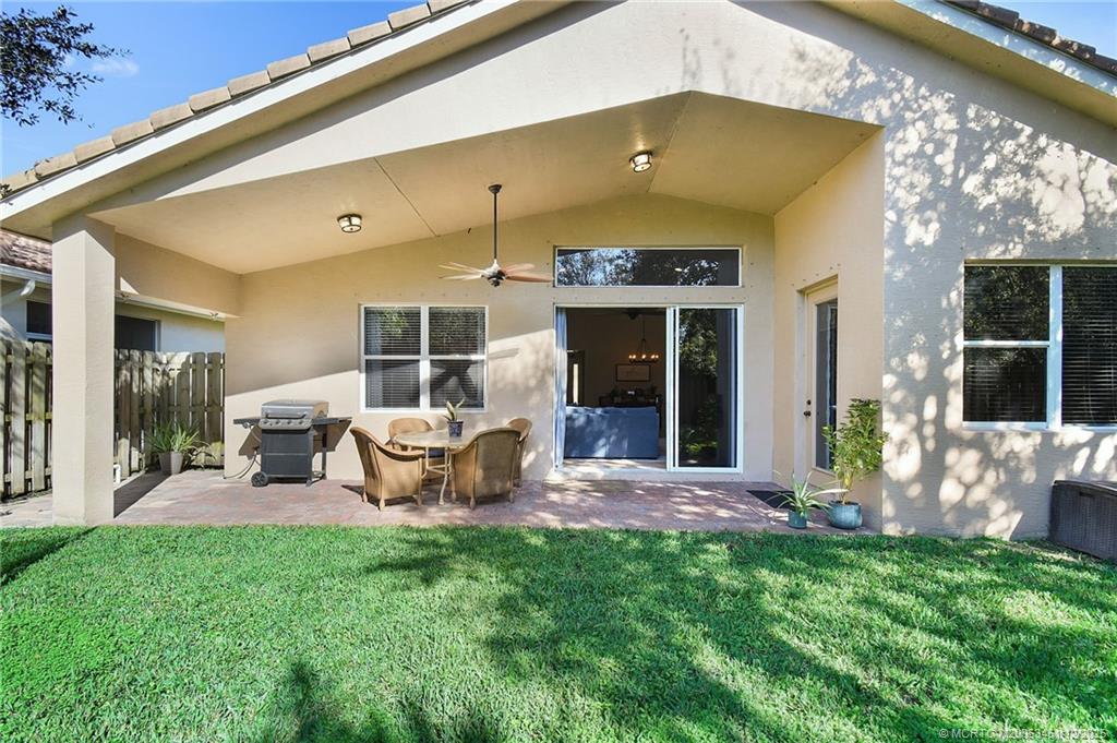 3141 Southwest Porpoise Circle Stuart, FL 34997 - Photo 19 of 45 a view of a house with backyard porch and furniture