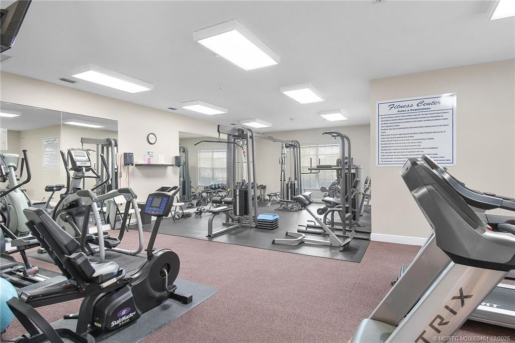 3141 Southwest Porpoise Circle Stuart, FL 34997 - Photo 23 of 45 a view of a room with gym equipment