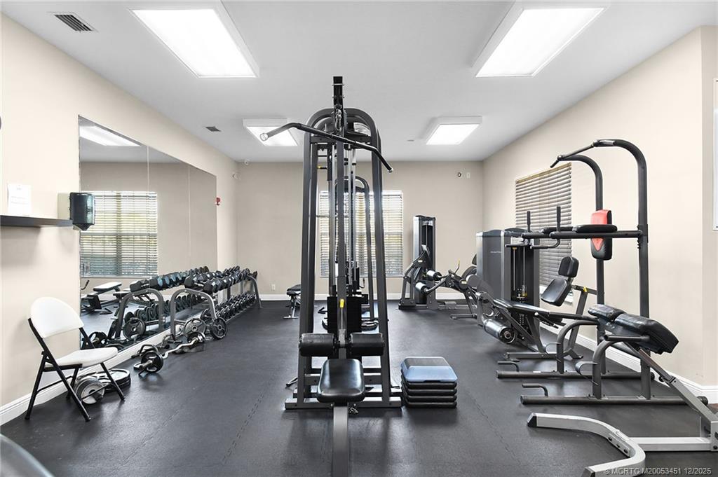 3141 Southwest Porpoise Circle Stuart, FL 34997 - Photo 25 of 45 a view of a room with gym equipment