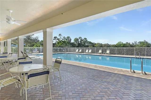 a view of swimming pool with seating space and hardwood floor