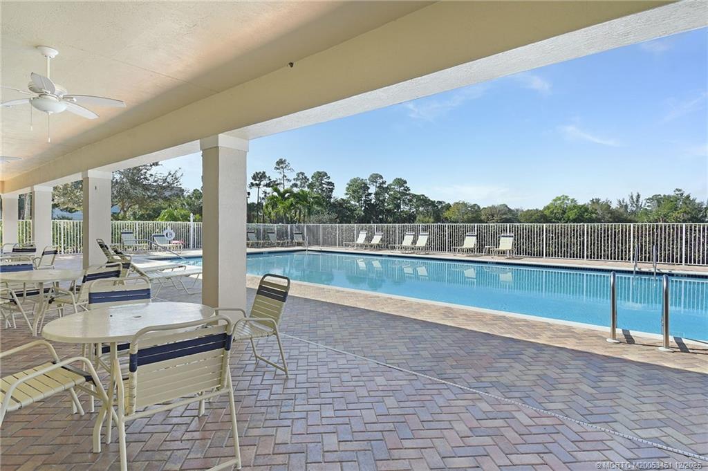 3141 Southwest Porpoise Circle Stuart, FL 34997 - Photo 26 of 45 a view of swimming pool with seating space and hardwood floor