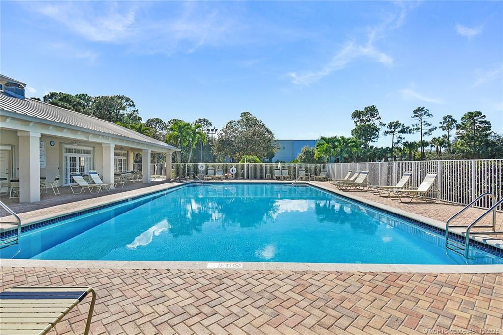 3141 Southwest Porpoise Circle Stuart, FL 34997 - Photo 27 of 45 a view of swimming pool with seating space