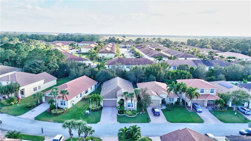 3141 Southwest Porpoise Circle Stuart, FL 34997 - Photo 31 of 45 an aerial view of residential houses with outdoor space