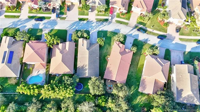 an aerial view of multiple houses with yard