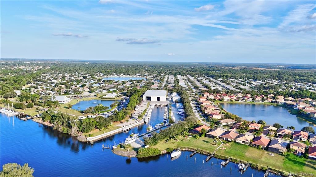 3141 Southwest Porpoise Circle Stuart, FL 34997 - Photo 36 of 45 an aerial view of residential houses with outdoor space