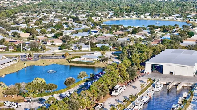 a view of a house with swimming pool outdoor seating