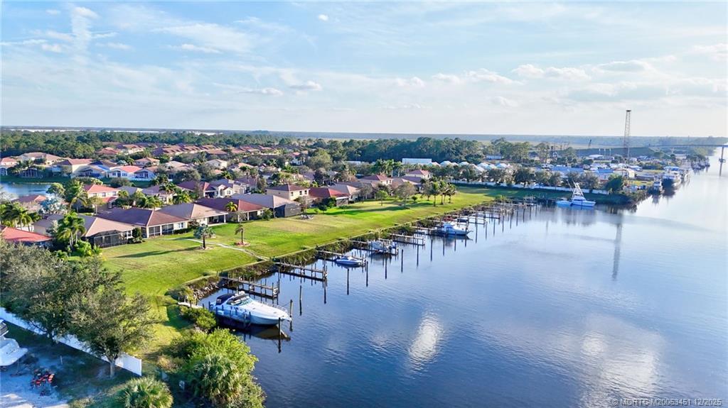 3141 Southwest Porpoise Circle Stuart, FL 34997 - Photo 44 of 45 an aerial view of a city with lots of residential buildings ocean and mountain view in back