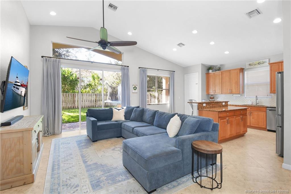 3141 Southwest Porpoise Circle Stuart, FL 34997 - Photo 5 of 45 a living room with furniture and a flat screen tv