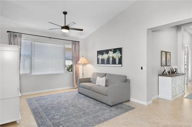a living room with furniture and a rug