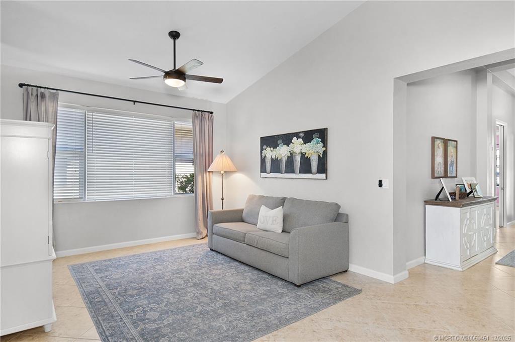 3141 Southwest Porpoise Circle Stuart, FL 34997 - Photo 9 of 45 a living room with furniture and a rug