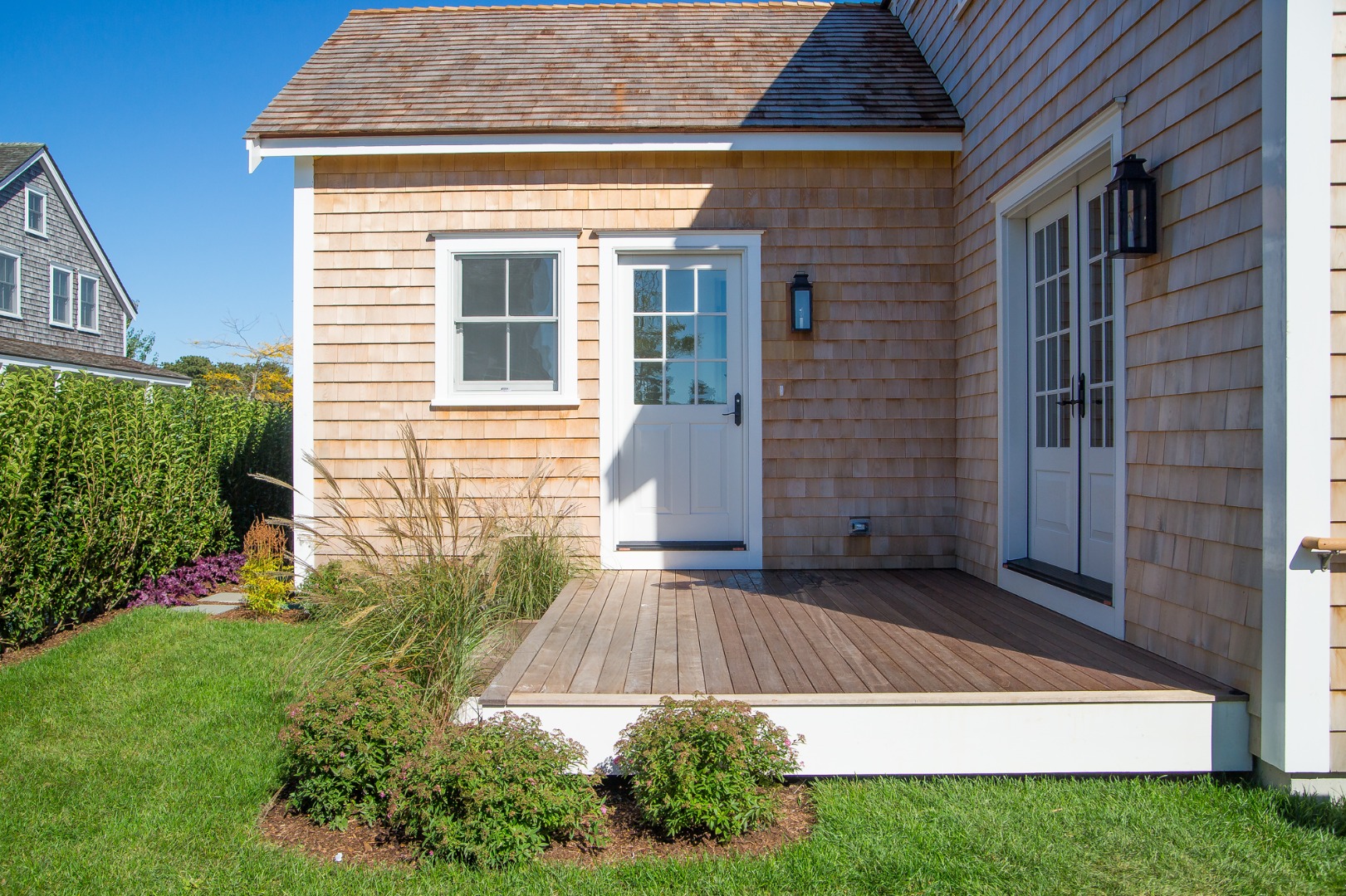 9 Wood Lily Road Nantucket, MA 02554 - Photo 4 of 27 a view of backyard with potted plants and a table