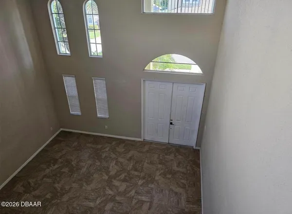 a kitchen with appliances a sink and cabinets