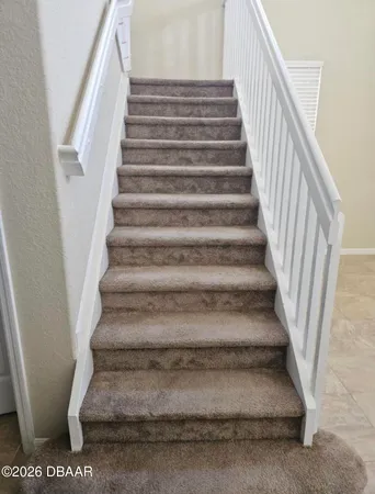 a view of kitchen with stainless steel appliances granite countertop a stove top oven a sink a counter top space cabinets and stainless steel appliances