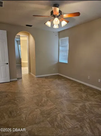 a view of an empty room with a window