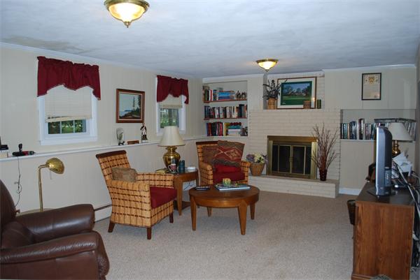 142 Alder Road Westwood, MA 02090 - Photo 11 of 13 a living room with furniture and a fireplace