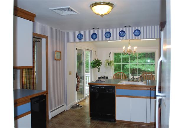 142 Alder Road Westwood, MA 02090 - Photo 2 of 13 a room with stainless steel appliances granite countertop a refrigerator and a sink