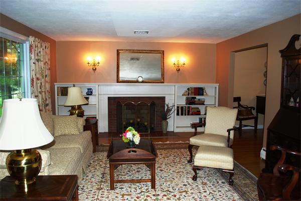 142 Alder Road Westwood, MA 02090 - Photo 3 of 13 a living room with furniture and a fireplace