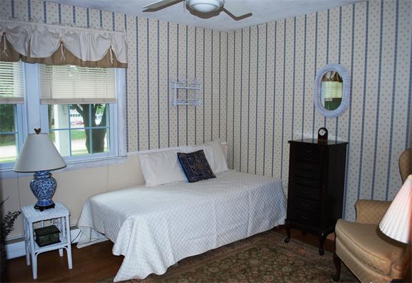 142 Alder Road Westwood, MA 02090 - Photo 6 of 13 a bedroom with a bed and dresser with mirror