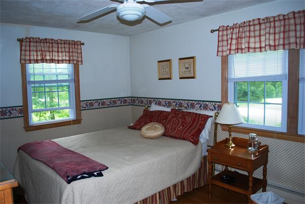 142 Alder Road Westwood, MA 02090 - Photo 7 of 13 a bedroom with a bed and wooden floor