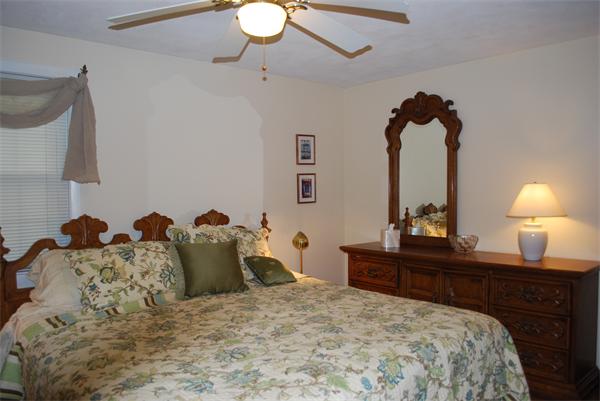 142 Alder Road Westwood, MA 02090 - Photo 8 of 13 a bedroom with a bed and a chandelier