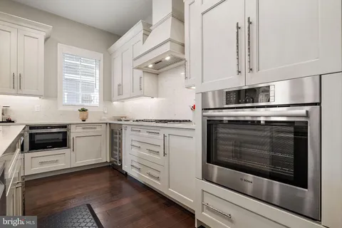 a view of a dining room with furniture wooden floor and chandelier