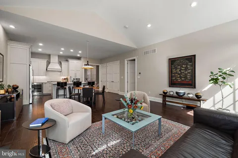 a living room with furniture window and wooden floor