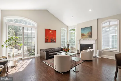 a living room with furniture fireplace and window