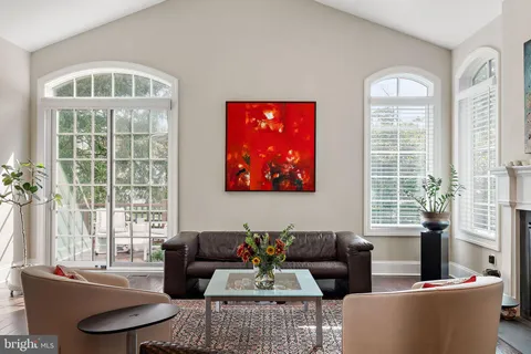 a view of a livingroom with shelves and wooden floor
