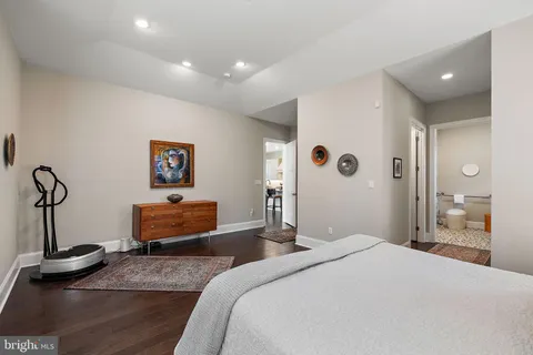 a bathroom with a toilet a sink and a mirror