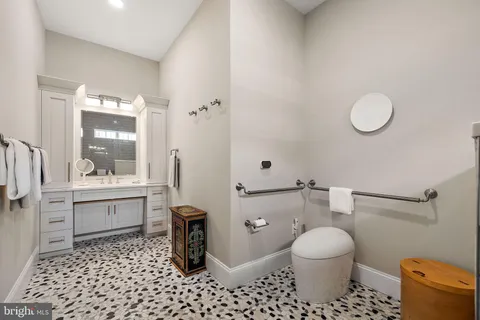 a bathroom with a toilet a sink and a shower