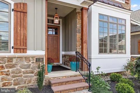 a view of hallway with wooden floor