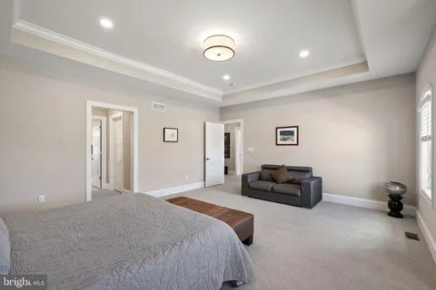 a bathroom with a granite countertop sink mirror and shower