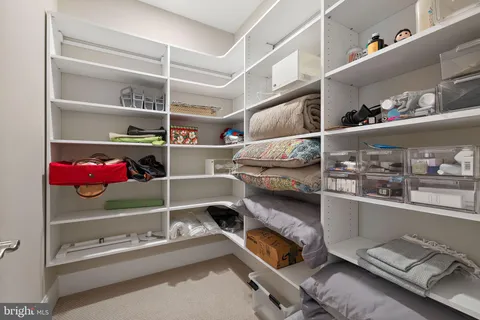 a room with storage and a book shelf