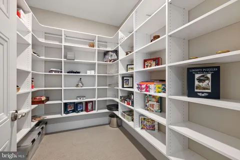 a dining room with furniture and a window