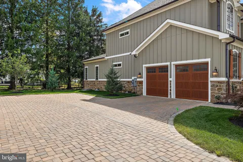a view of a house with backyard porch and sitting area