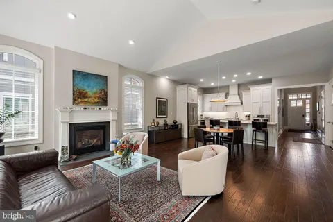 a open kitchen with stainless steel appliances a stove and a refrigerator