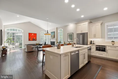 a view of a a dining room with furniture window and wooden floor