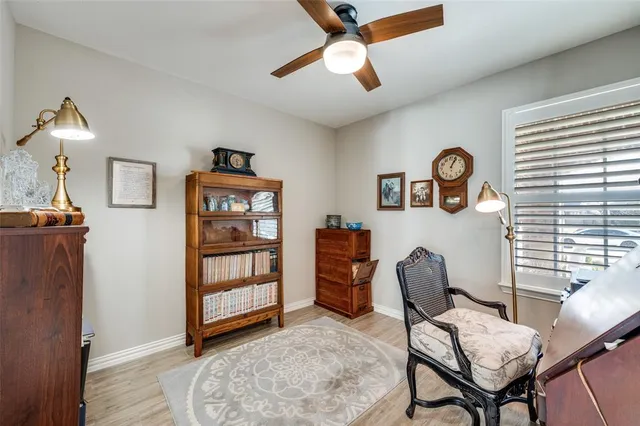 a view of a livingroom with furniture and a window