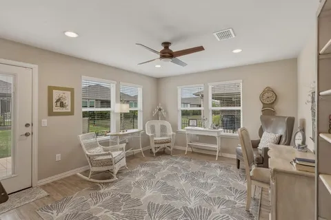 a living room with furniture and windows