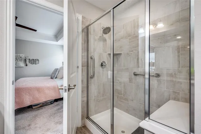 a bathroom with a bathtub and a shower