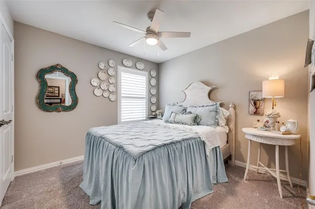 a bedroom with a bed and a table