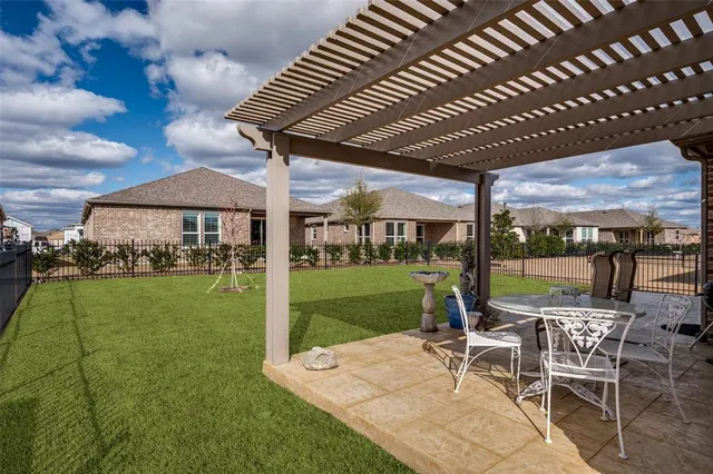 a view of a patio with a backyard
